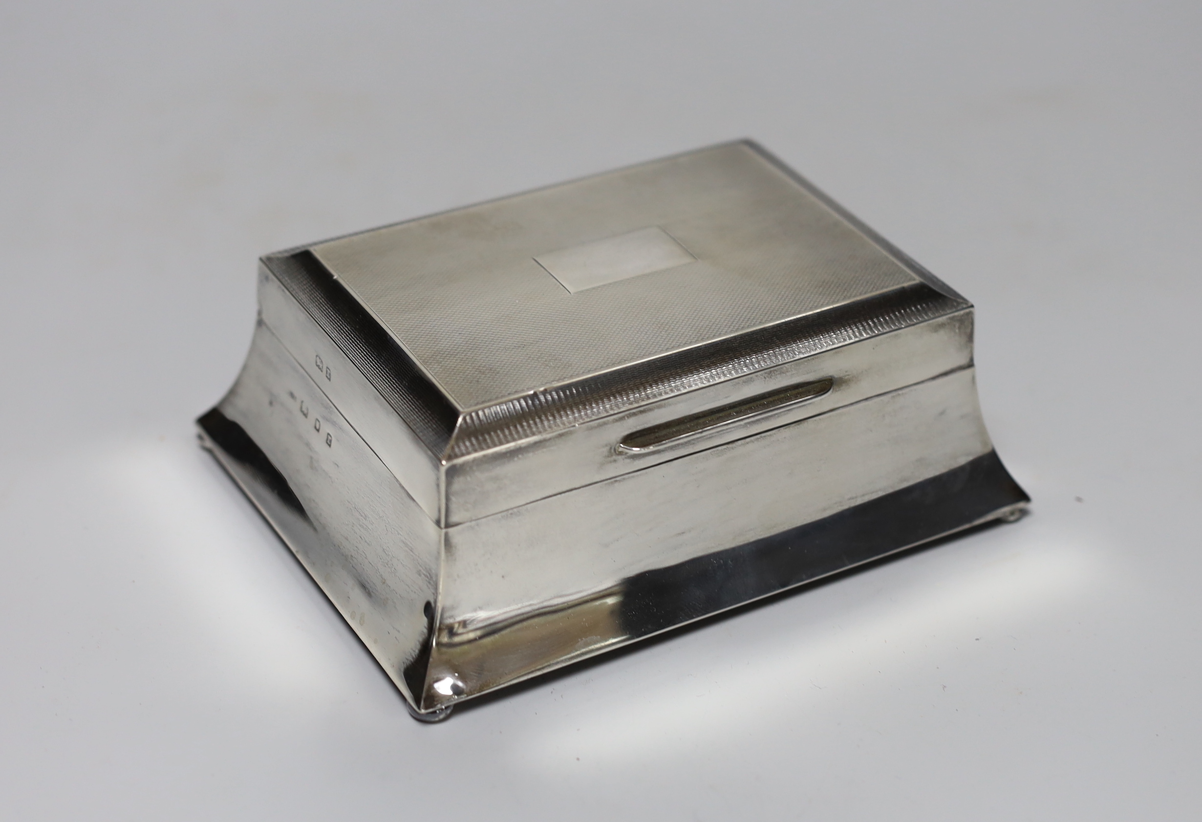 A George V Art Deco part engine turned silver mounted rectangular cigarette case, London, 1932, 15.2cm.